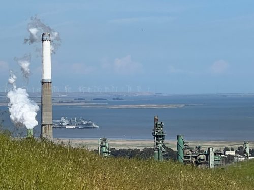 Pending Valero refinery closure Benicia—Overlooking the refinery, with clean windfarm mills across the bay