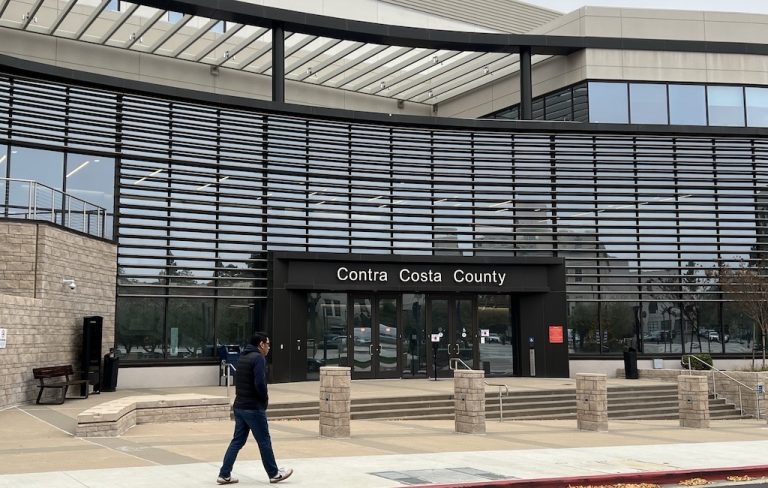 Find climate action in CC County Man walking in front of the Contra Costa County Administrative Building