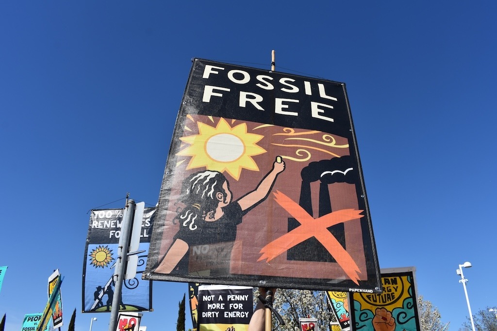 350 Contra Costa Action Antioch Rally Fossil Free and other signs calling for renewable energy sources and an end to fossil fuels