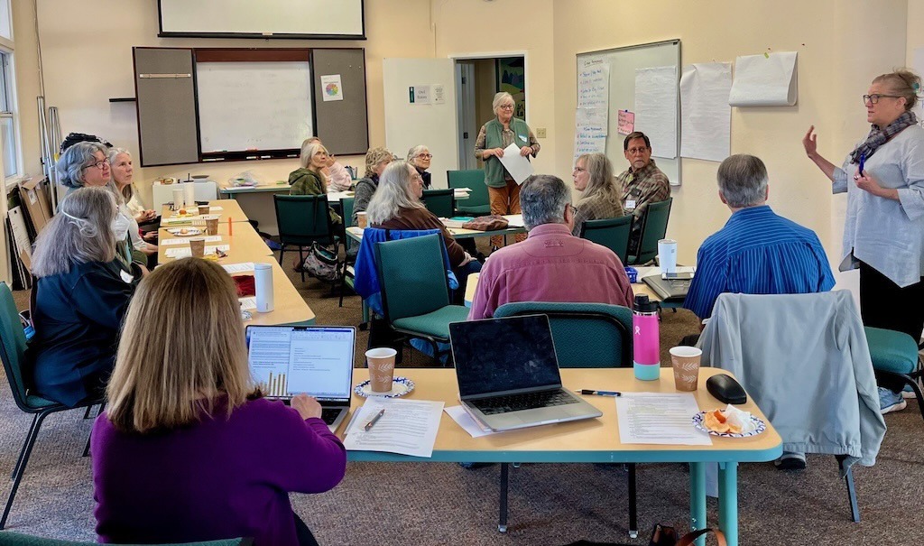 Contra Costa Climate Action 350 Contra Costa Action members discussing 2026 plans Image credit: Volunteer Staff Photo