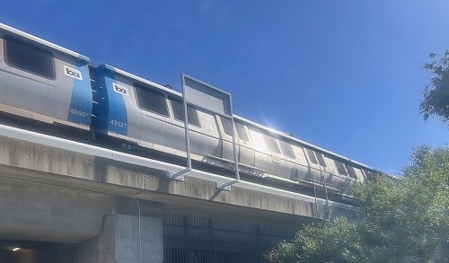 Silver metro train on an elevated track against a clear blue sky. 350 Contra Costa Action | Local action for a better world 350 Contra Costa Action | Local action for a better world