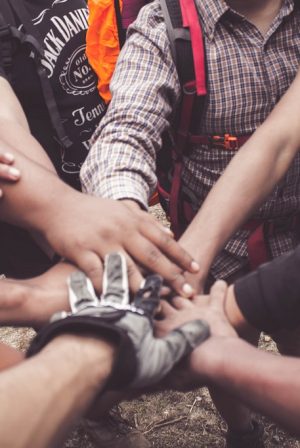People doing group hand cheer